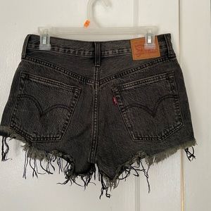 Levi’s 501 black wash distressed jean shorts with button fly- W26
